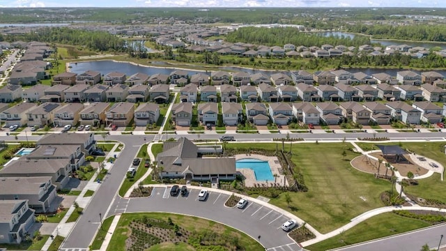 bird's eye view with a water view and a residential view