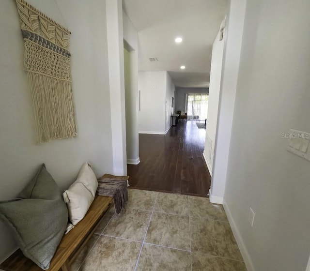 hallway featuring baseboards, tile patterned flooring, recessed lighting, and visible vents