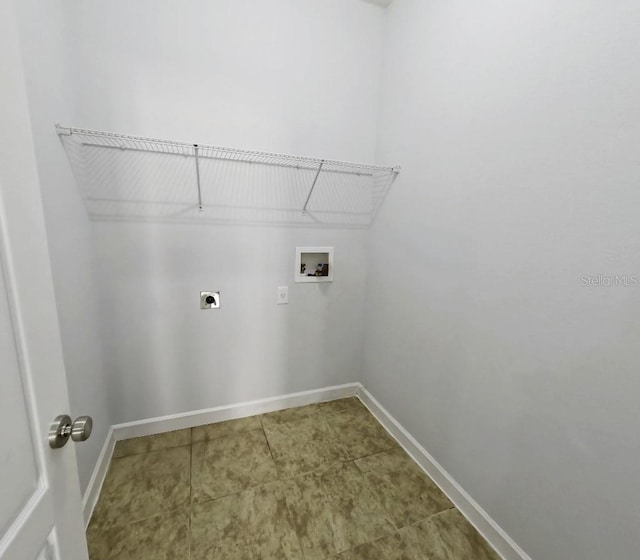 clothes washing area with baseboards, laundry area, electric dryer hookup, and washer hookup