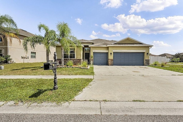 18677 Milton Keynes Ct, Land O Lakes, FL 34638 - view of front of house with stucco siding, a garage, concrete driveway, and a front lawn