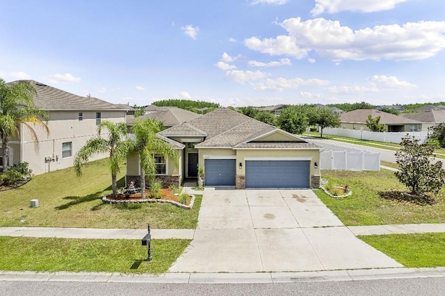 18677 Milton Keynes Ct, Land O Lakes, FL 34638 - view of front of home featuring an attached garage, driveway, a residential view, and stucco siding