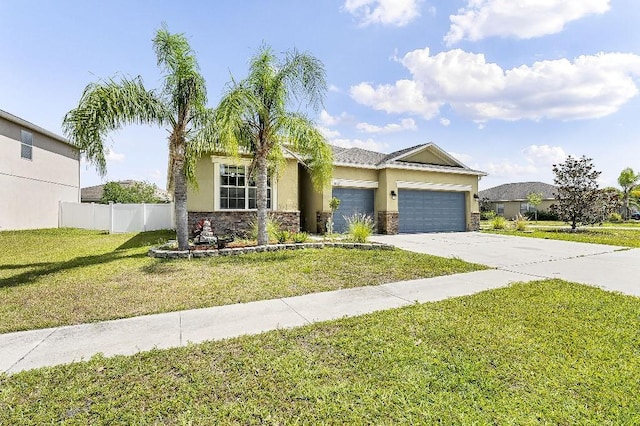 18677 Milton Keynes Ct, Land O Lakes, FL 34638 - view of front of property with a garage, stucco siding, concrete driveway, and stone siding