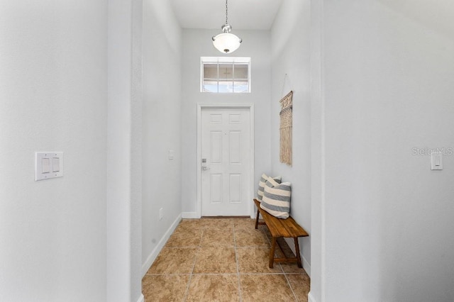 18677 Milton Keynes Ct, Land O Lakes, FL 34638 - doorway featuring light tile patterned flooring and baseboards