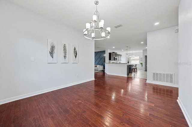 18677 Milton Keynes Ct, Land O Lakes, FL 34638 - unfurnished living room featuring a chandelier, dark wood-style floors, baseboards, and recessed lighting