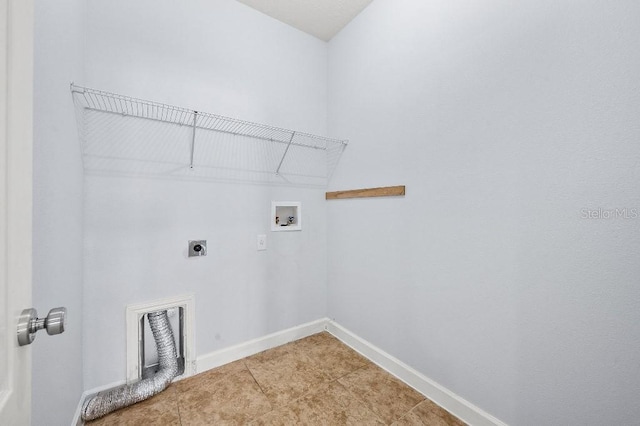 18677 Milton Keynes Ct, Land O Lakes, FL 34638 - laundry room featuring hookup for an electric dryer, washer hookup, baseboards, and light tile patterned flooring