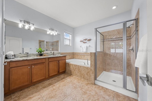 18677 Milton Keynes Ct, Land O Lakes, FL 34638 - bathroom featuring a shower stall, a garden tub, double vanity, and tile patterned floors