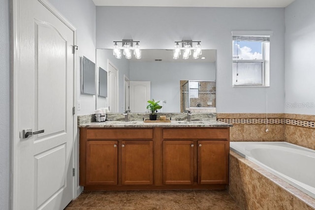 18677 Milton Keynes Ct, Land O Lakes, FL 34638 - bathroom featuring a shower stall, a bath, double vanity, and tile patterned flooring