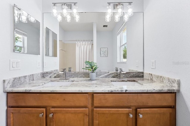 18677 Milton Keynes Ct, Land O Lakes, FL 34638 - bathroom featuring double vanity and a shower with shower curtain