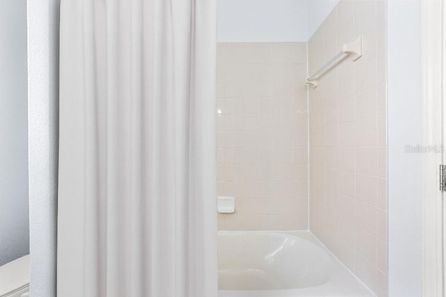 18677 Milton Keynes Ct, Land O Lakes, FL 34638 - bathroom with shower / bathtub combination with curtain