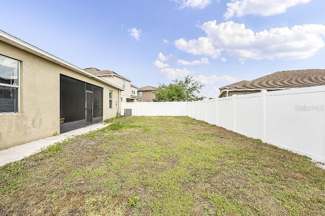 18677 Milton Keynes Ct, Land O Lakes, FL 34638 - view of yard featuring a sunroom and central AC unit