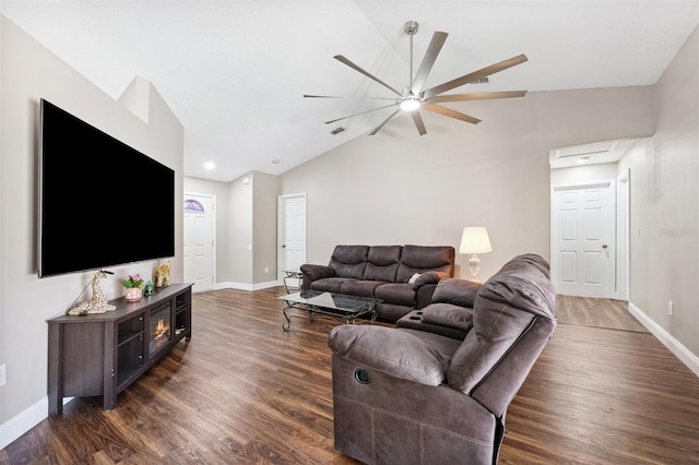 13040 Hanley Dr, Spring Hill, FL 34609 - living area featuring lofted ceiling, dark wood-style flooring, and baseboards
