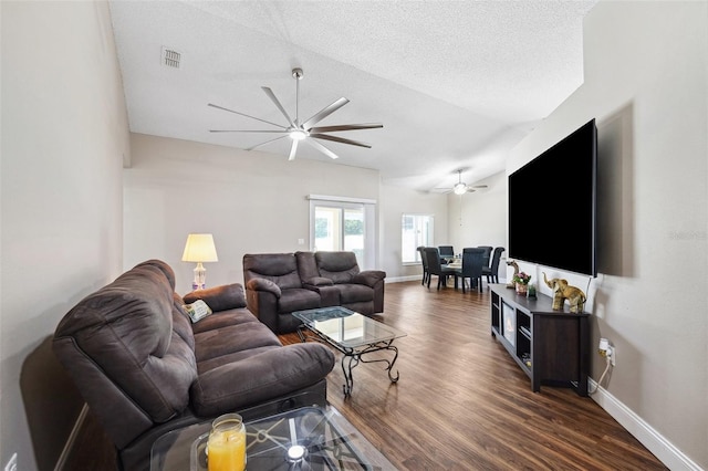 13040 Hanley Dr, Spring Hill, FL 34609 - living room with ceiling fan, visible vents, baseboards, and dark wood-type flooring