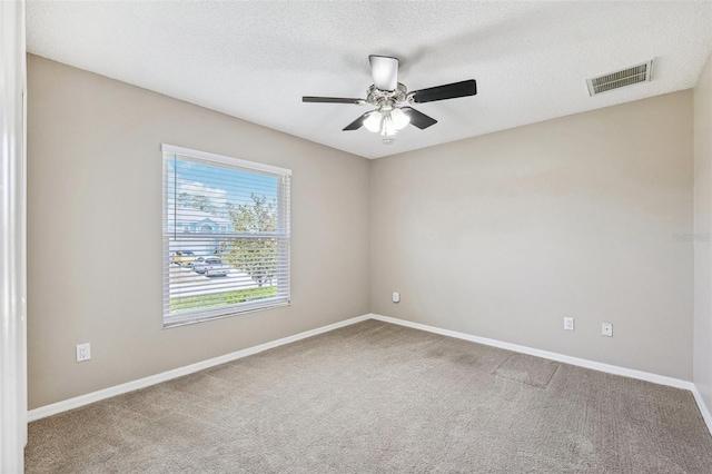 13040 Hanley Dr, Spring Hill, FL 34609 - empty room with a ceiling fan, carpet, and a textured ceiling