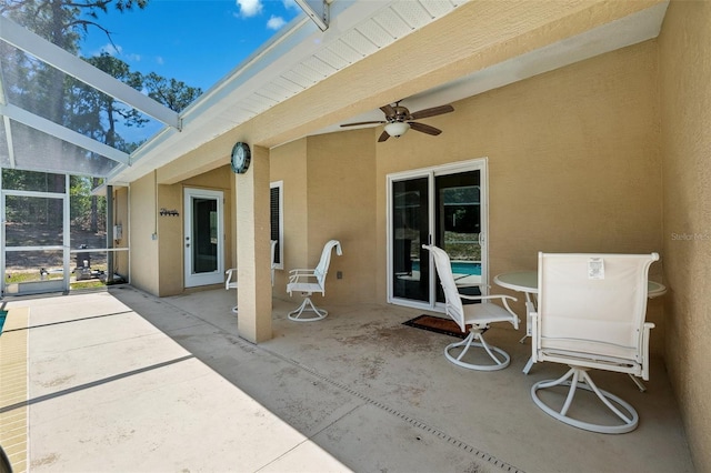 13040 Hanley Dr, Spring Hill, FL 34609 - view of patio with ceiling fan and glass enclosure