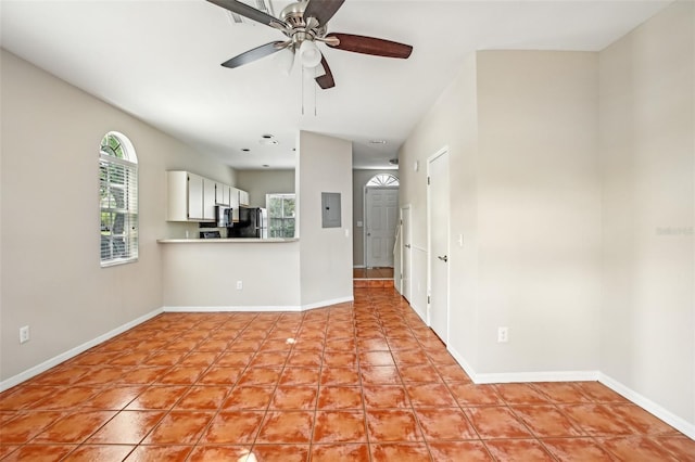 8101 Interbay Blvd Unit A, Tampa, FL 33616 - unfurnished living room featuring electric panel, ceiling fan, and baseboards