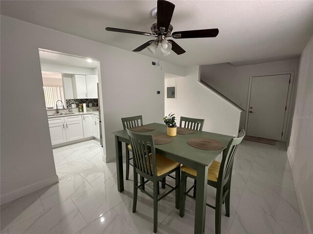 4022 Cortez Dr Unit A, Tampa, FL 33614 - dining room featuring a ceiling fan, baseboards, visible vents, and marble finish floor