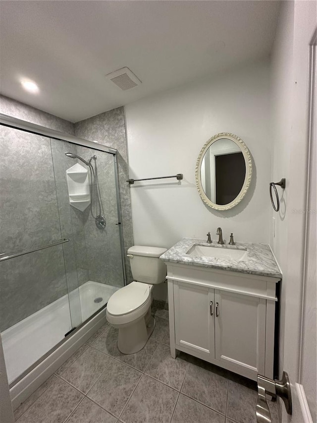 4022 Cortez Dr Unit A, Tampa, FL 33614 - full bathroom featuring visible vents, vanity, toilet, tile patterned floors, and a stall shower
