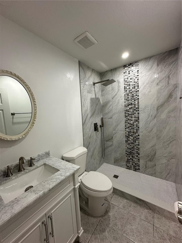 4022 Cortez Dr Unit A, Tampa, FL 33614 - full bath featuring a tile shower, vanity, toilet, tile patterned floors, and visible vents