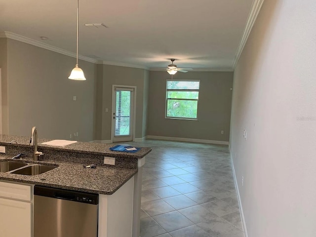 kitchen featuring a sink, dishwasher, dark stone countertops, decorative light fixtures, and ornamental molding