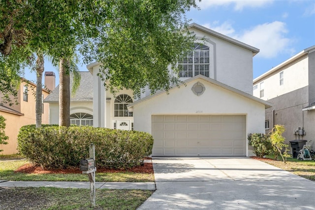 view of front of home with driveway and stucco siding