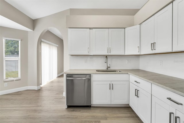 kitchen featuring a sink, light countertops, white cabinets, and stainless steel dishwasher
