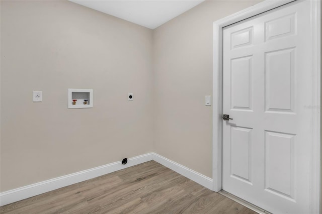 washroom featuring laundry area, light wood-style floors, baseboards, washer hookup, and hookup for an electric dryer