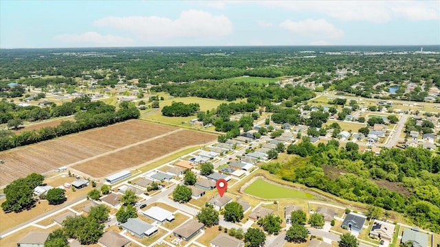 drone / aerial view with a water view and a residential view