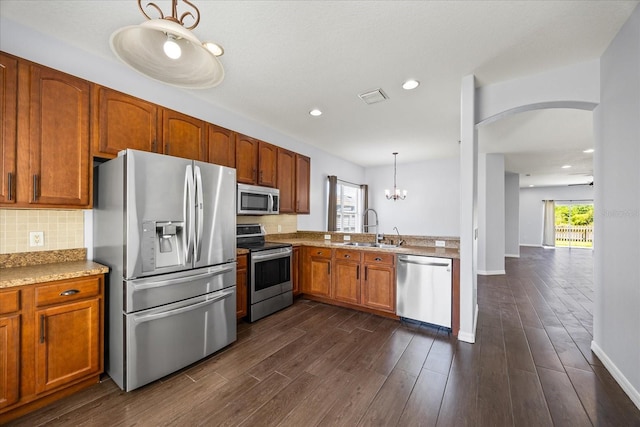 kitchen featuring a sink, tasteful backsplash, visible vents, and appliances with stainless steel finishes