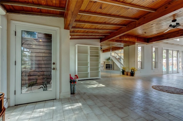 919 Sandpiper Way S, Saint Petersburg, FL 33707 - doorway to outside featuring wooden ceiling, stairs, beamed ceiling, and wood finished floors