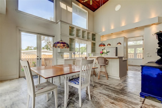 919 Sandpiper Way S, Saint Petersburg, FL 33707 - dining room with light wood-type flooring, french doors, high vaulted ceiling, and wooden ceiling