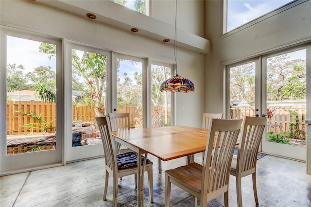 919 Sandpiper Way S, Saint Petersburg, FL 33707 - dining room featuring french doors and concrete floors