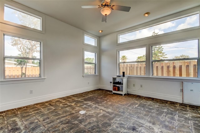 919 Sandpiper Way S, Saint Petersburg, FL 33707 - spare room featuring baseboards and a ceiling fan