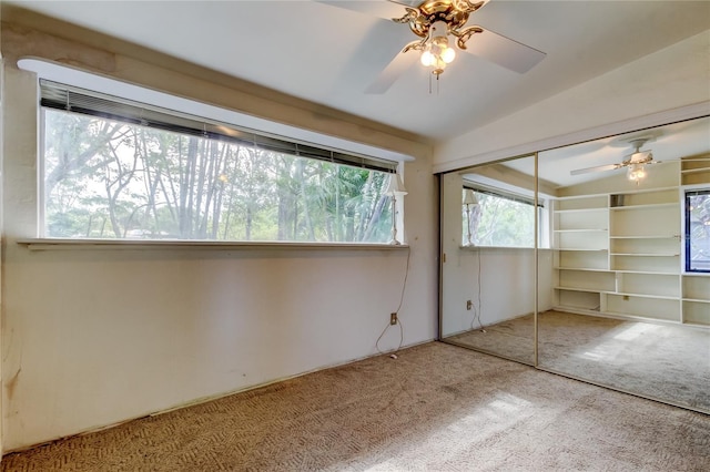 919 Sandpiper Way S, Saint Petersburg, FL 33707 - unfurnished bedroom featuring carpet, a closet, and a ceiling fan