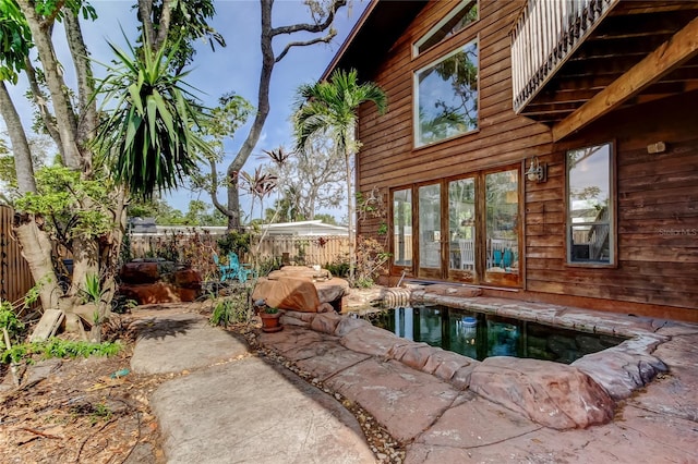 919 Sandpiper Way S, Saint Petersburg, FL 33707 - view of pool with a patio area, french doors, and a fenced backyard