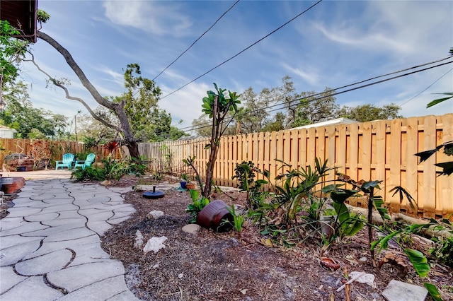 919 Sandpiper Way S, Saint Petersburg, FL 33707 - view of yard featuring a patio area and a fenced backyard