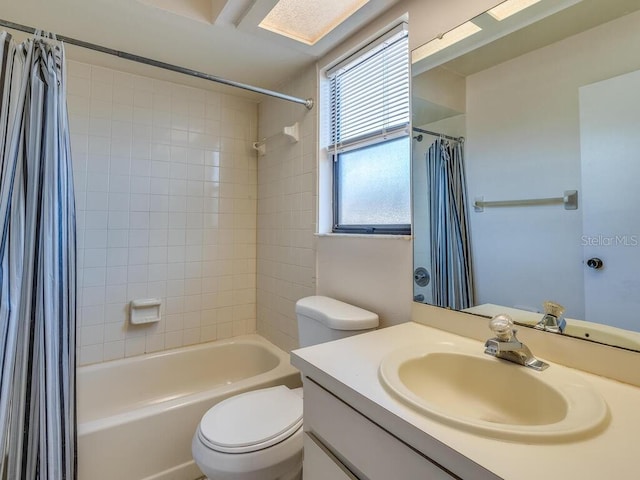 full bath featuring vanity, shower / bathtub combination with curtain, and toilet