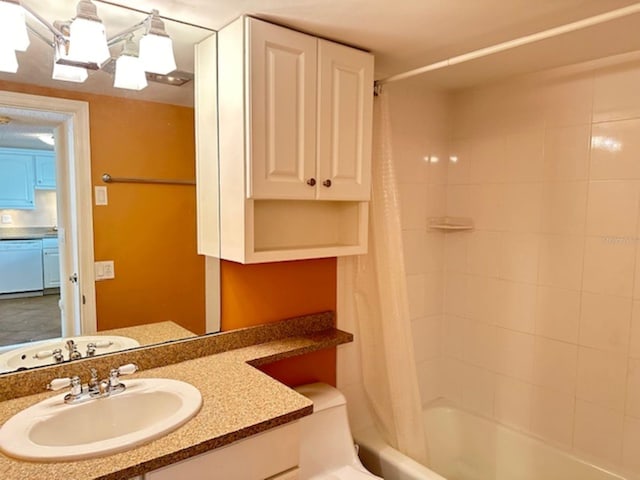 bathroom featuring shower / tub combo and vanity