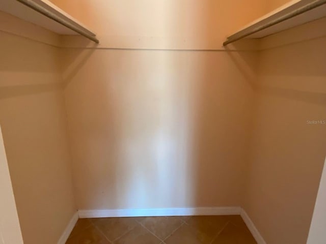 spacious closet featuring tile patterned floors