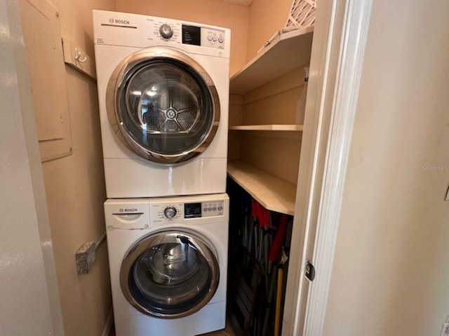 clothes washing area with stacked washer / drying machine