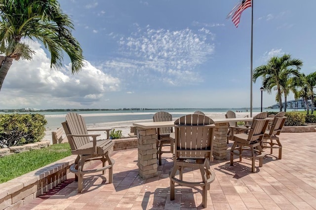 view of patio featuring a water view