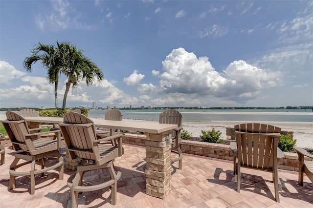 view of patio featuring a water view
