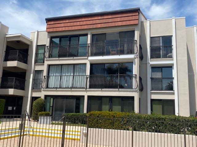 view of property with fence
