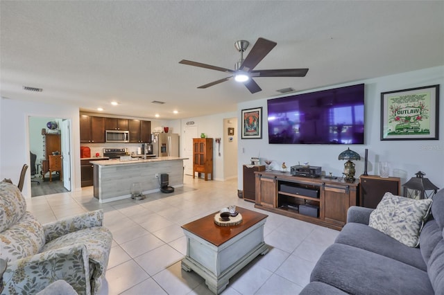 living area featuring a ceiling fan, recessed lighting, visible vents, and light tile patterned flooring