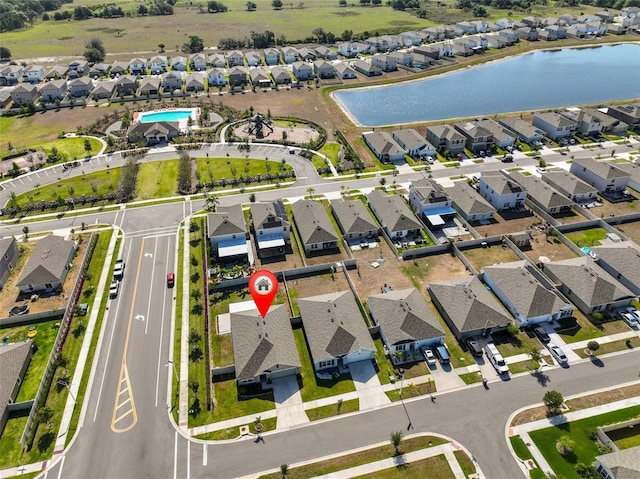 aerial view featuring a water view and a residential view
