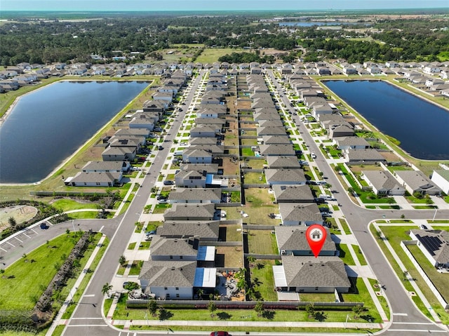 aerial view with a water view and a residential view