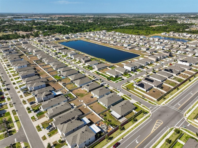 aerial view featuring a water view and a residential view
