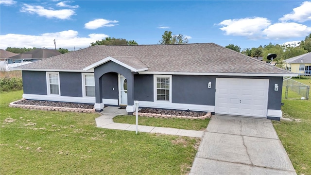 ranch-style house with a shingled roof, stucco siding, a garage, and driveway