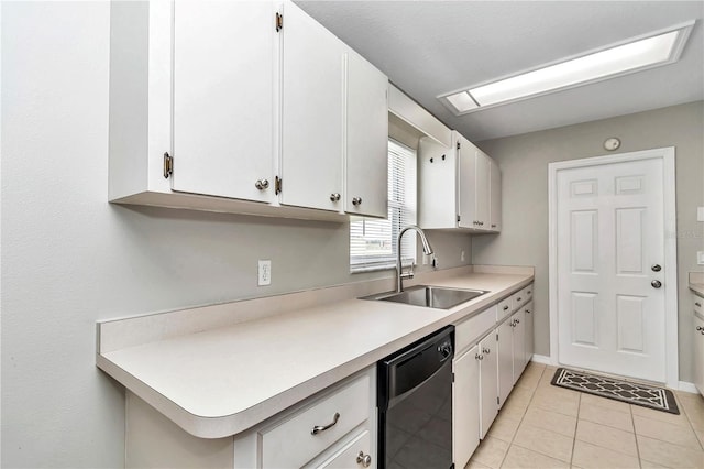 kitchen with a sink, dishwasher, light countertops, and white cabinets