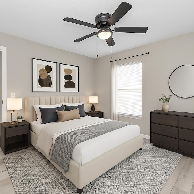bedroom with light wood finished floors, ceiling fan, and baseboards