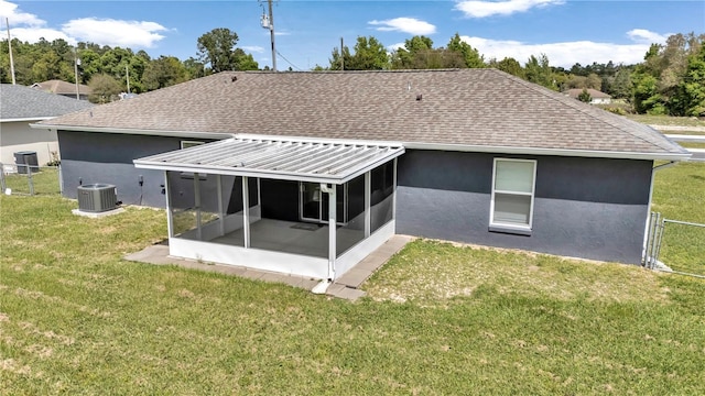 back of house with a sunroom, roof with shingles, cooling unit, stucco siding, and a gate